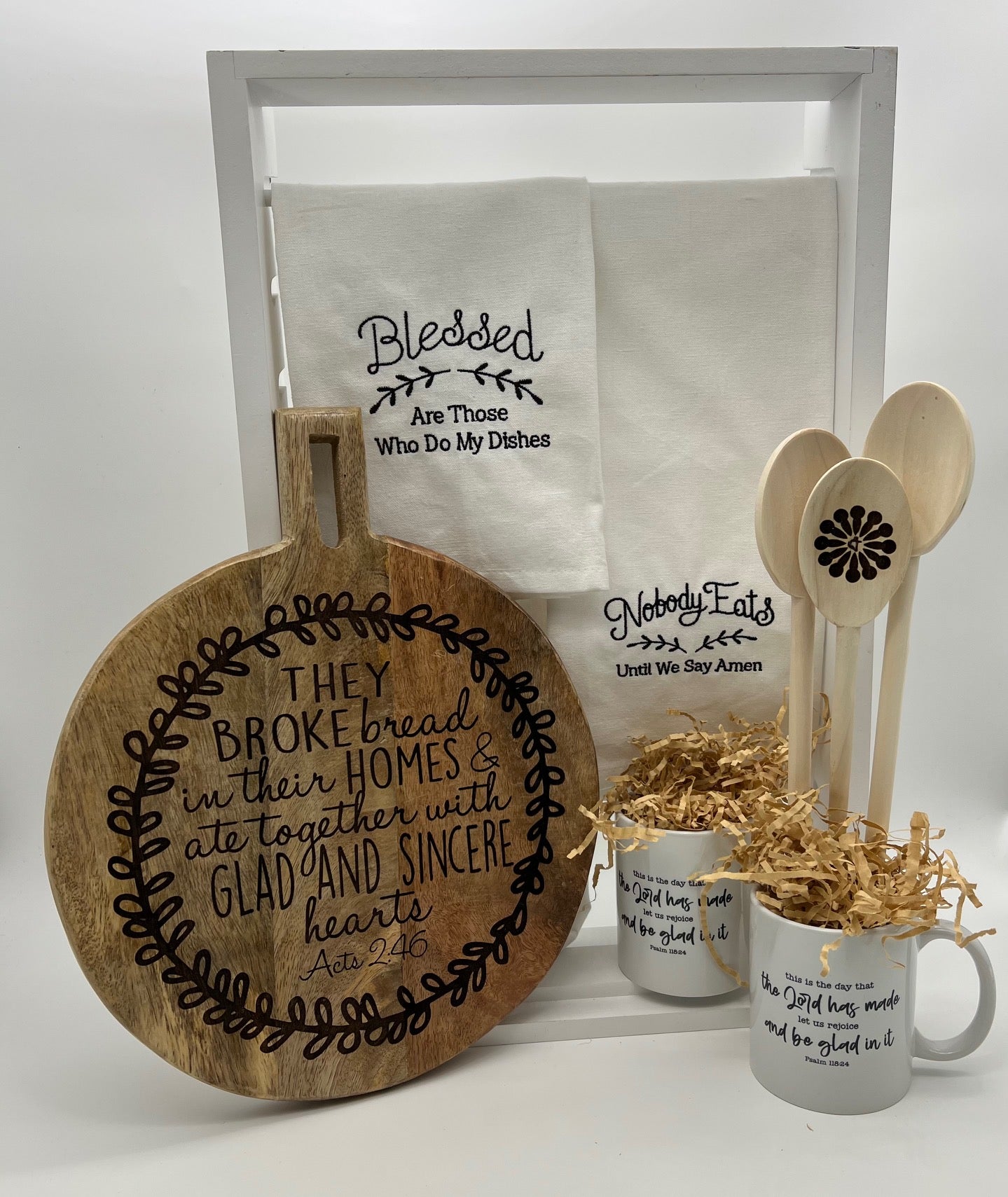 Customized kitchen set of hand towels, coffee mugs, wooden spoons and  charcuterie board.
